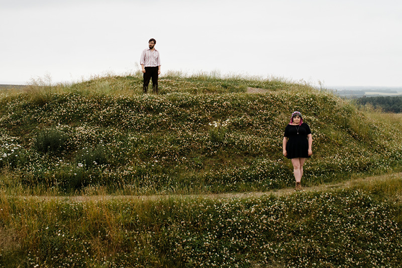 Will Finn & Rosie Calvert stood on a hill