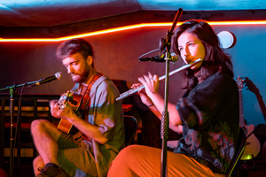 Destan Dönemi image. The duo are playing live on stage.